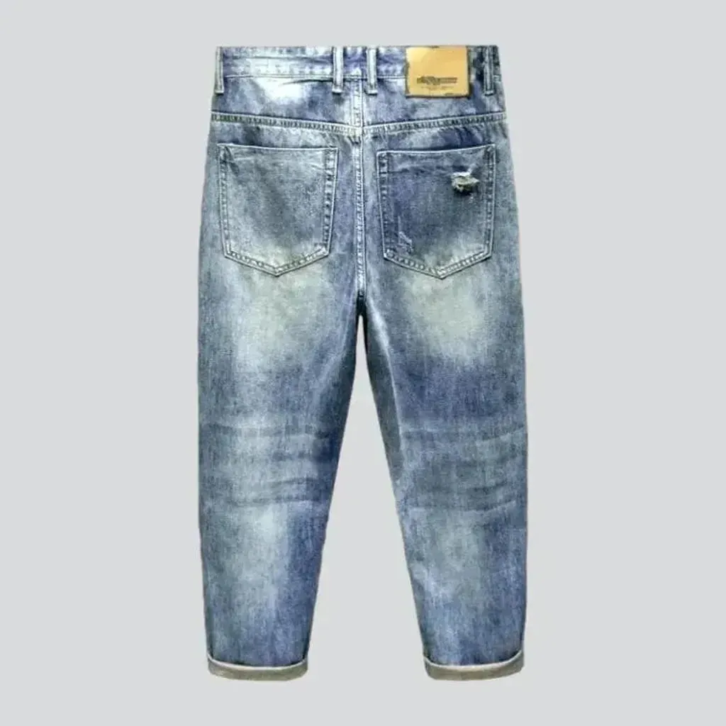 Medium-wash men's grunge jeans